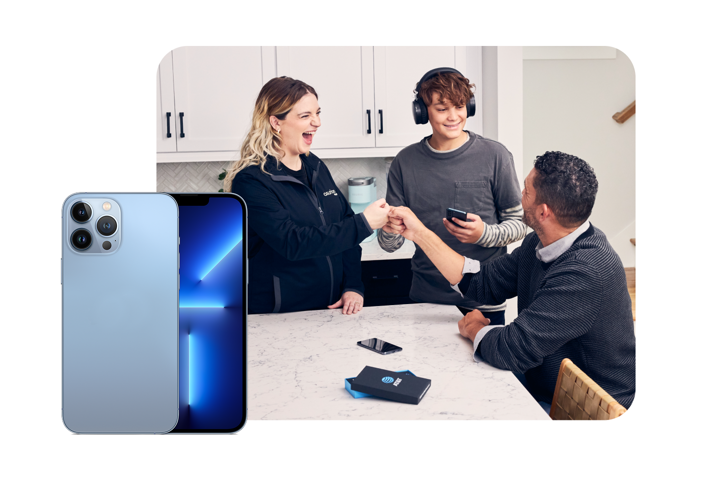Family in kitchen with devices