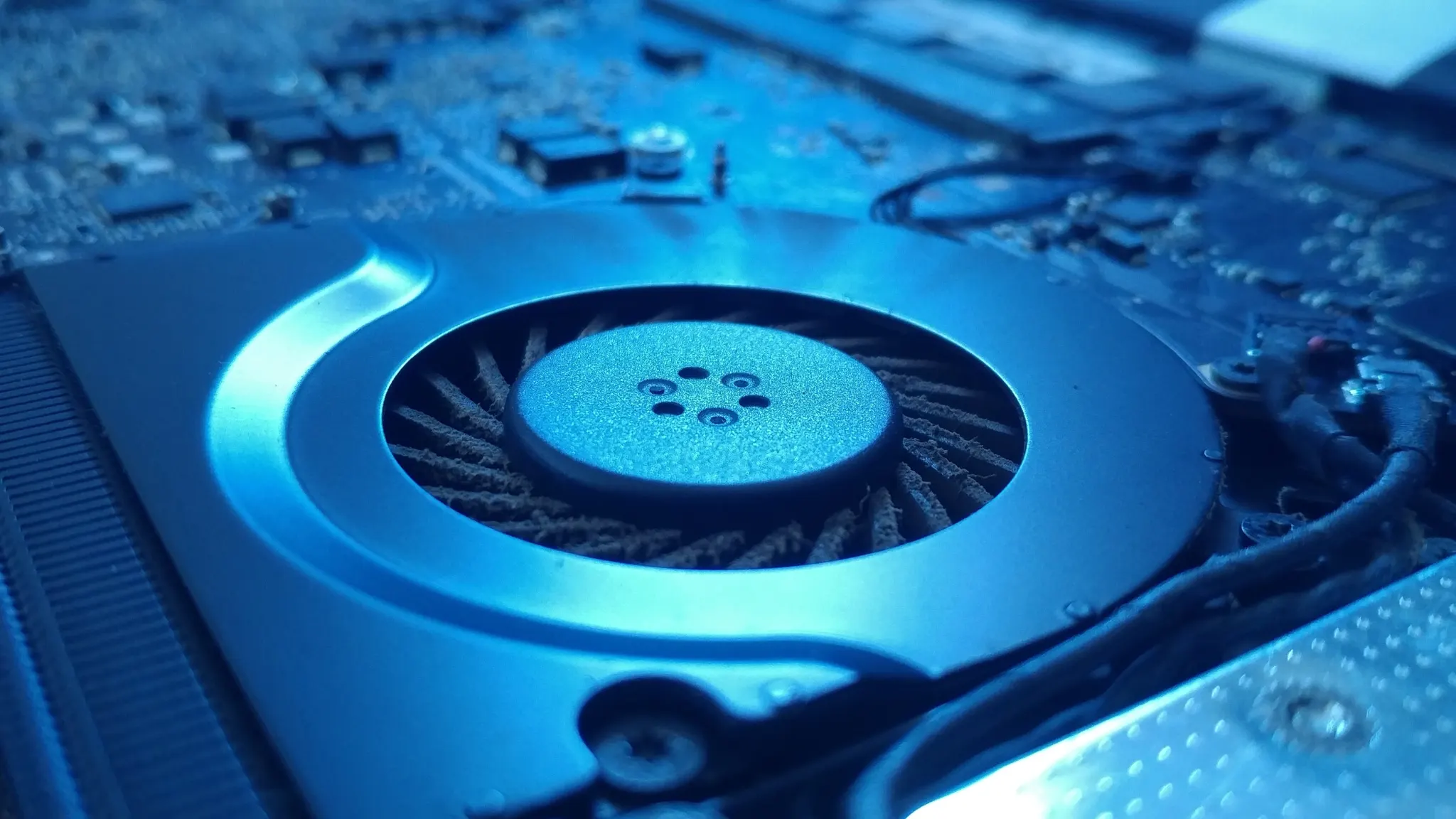 Laptop fan running loudly, illustrating causes like high CPU usage and dust buildup and how to fix overheating issues