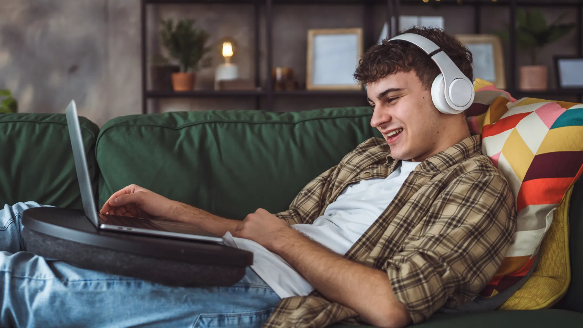 Person watching Netflix on MacBook, illustrating how to stream Netflix on Mac using a browser or AirPlay