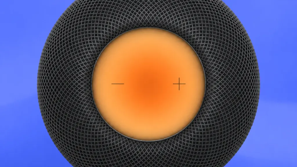 Top-down image of a black HomePod with a glowing orange face