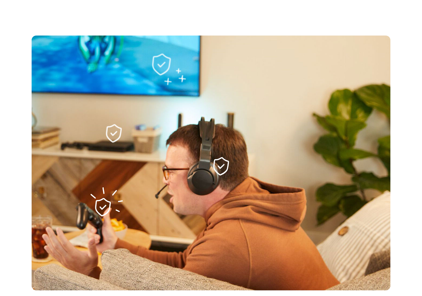man playing video game with game consoles and headphones