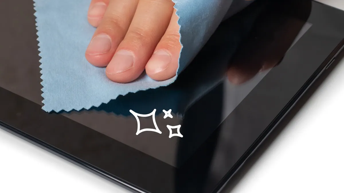 Person cleaning iPad screen safely