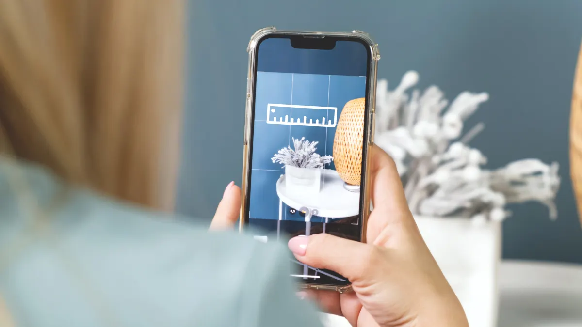 Woman using Measure app on iPhone