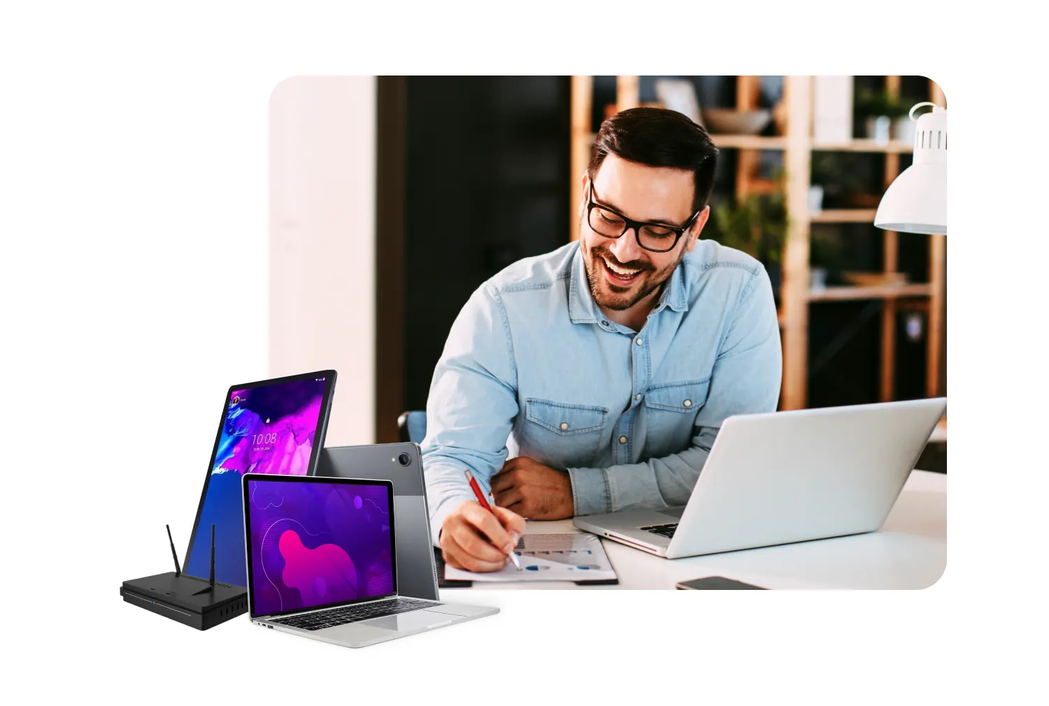 Man working at desk with devices