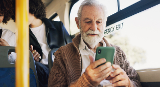 old man using his phone