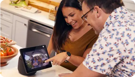 Couple use a tablet to see their front door camera