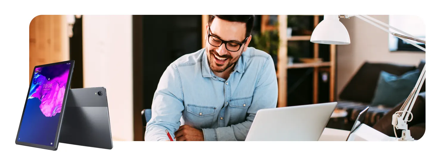 Man working at desk with devices