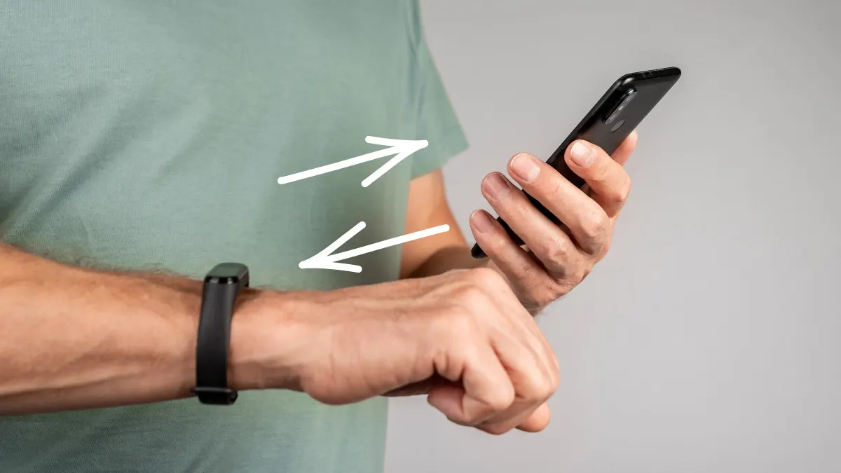 Man fixing a Fitbit that won’t sync with phone