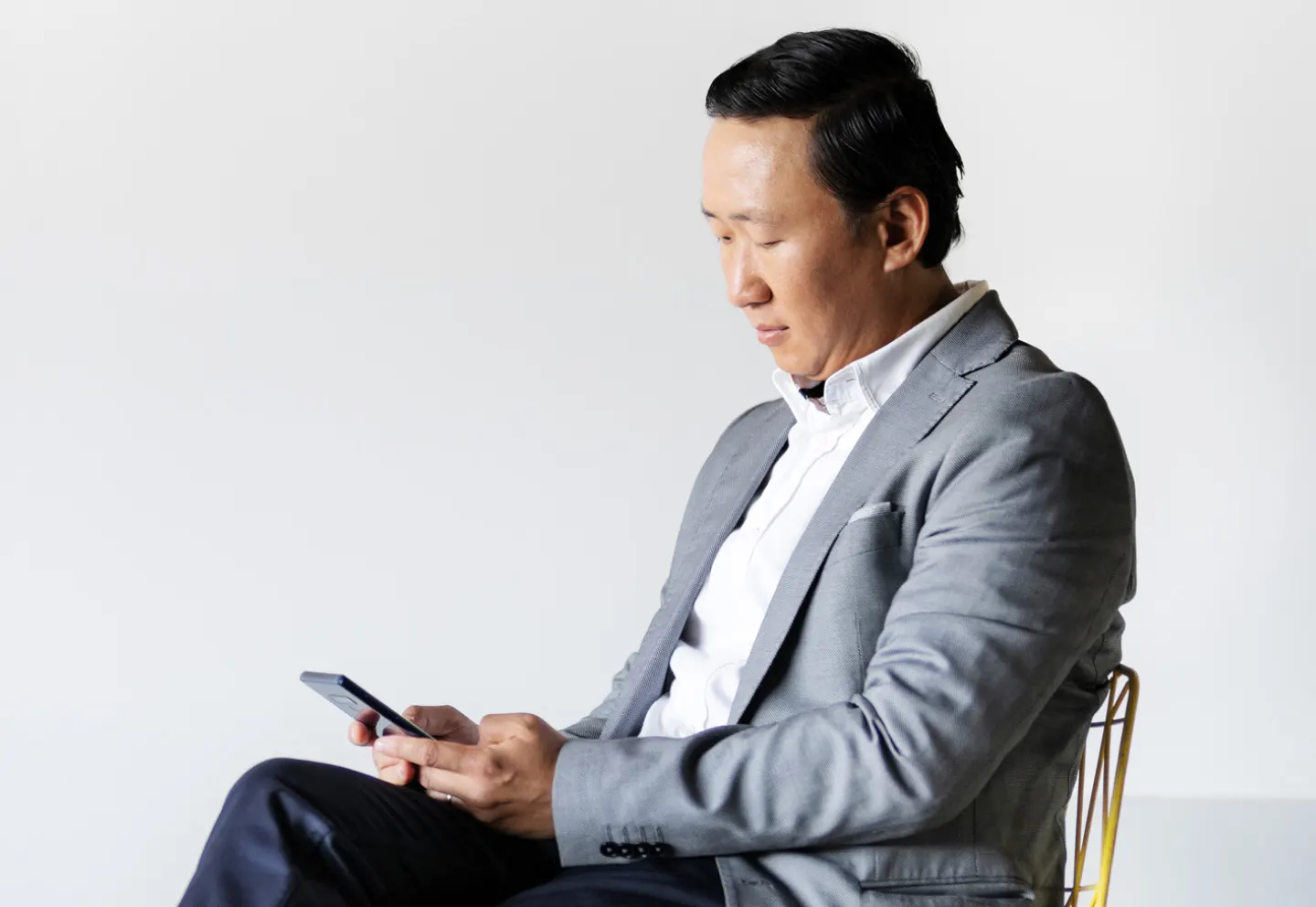 Business man holding a phone