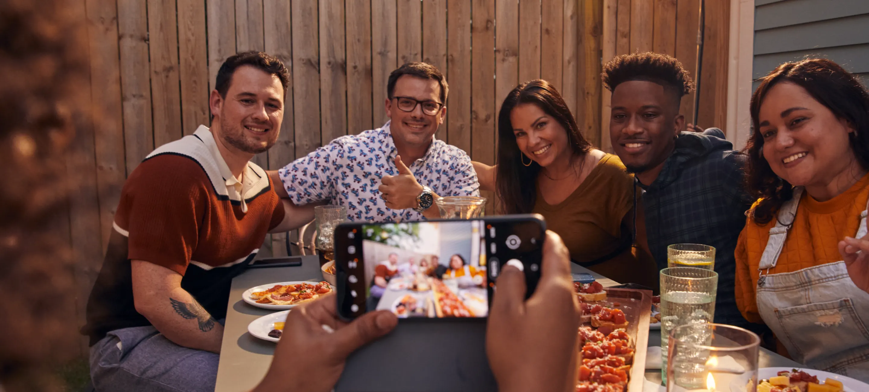 Group of friends taking a photo with a smart phone