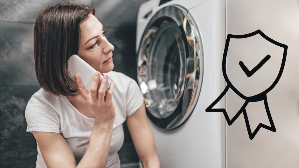Woman on phone looking at broken washing machine