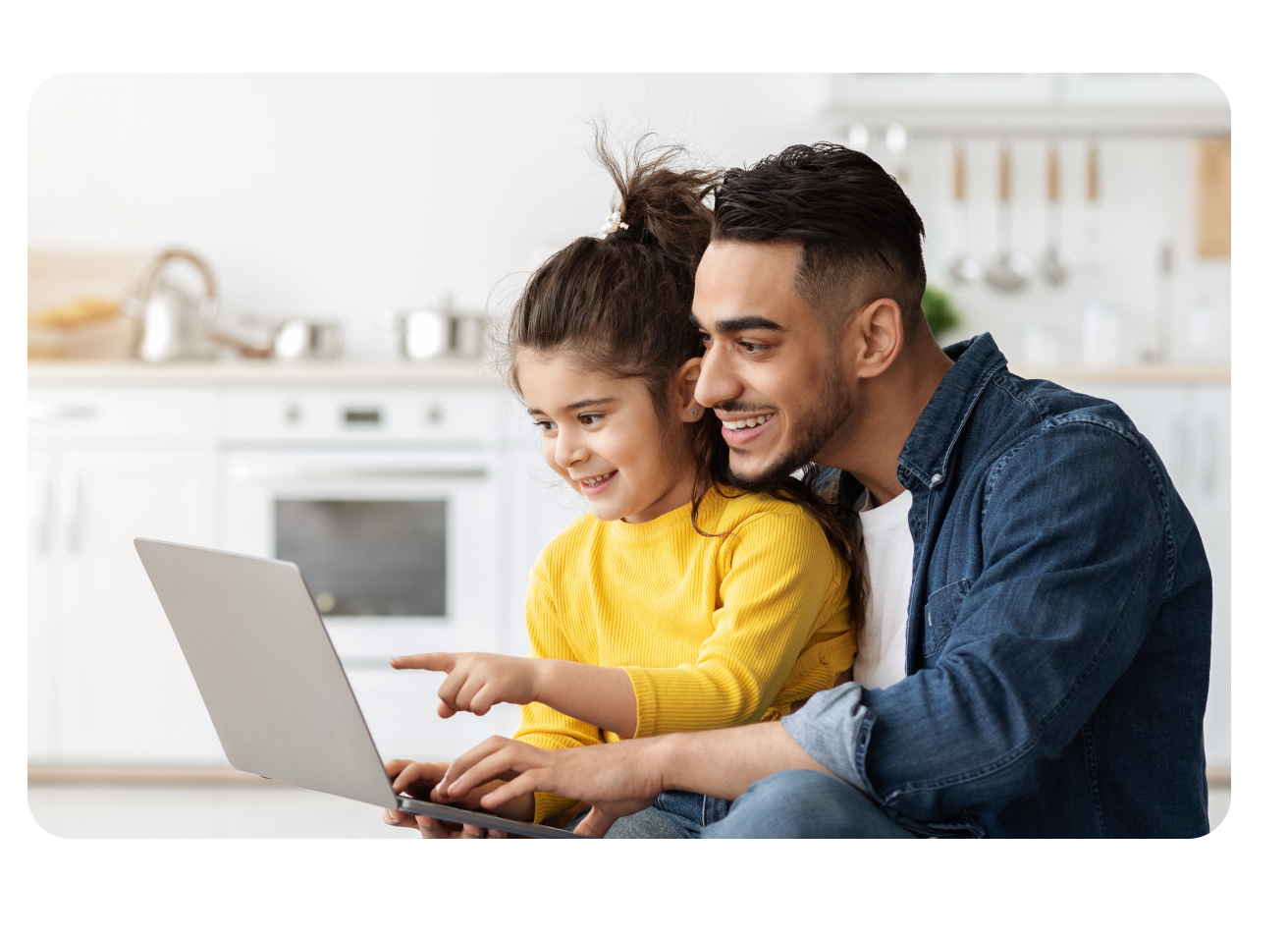 Father and daughter on laptop