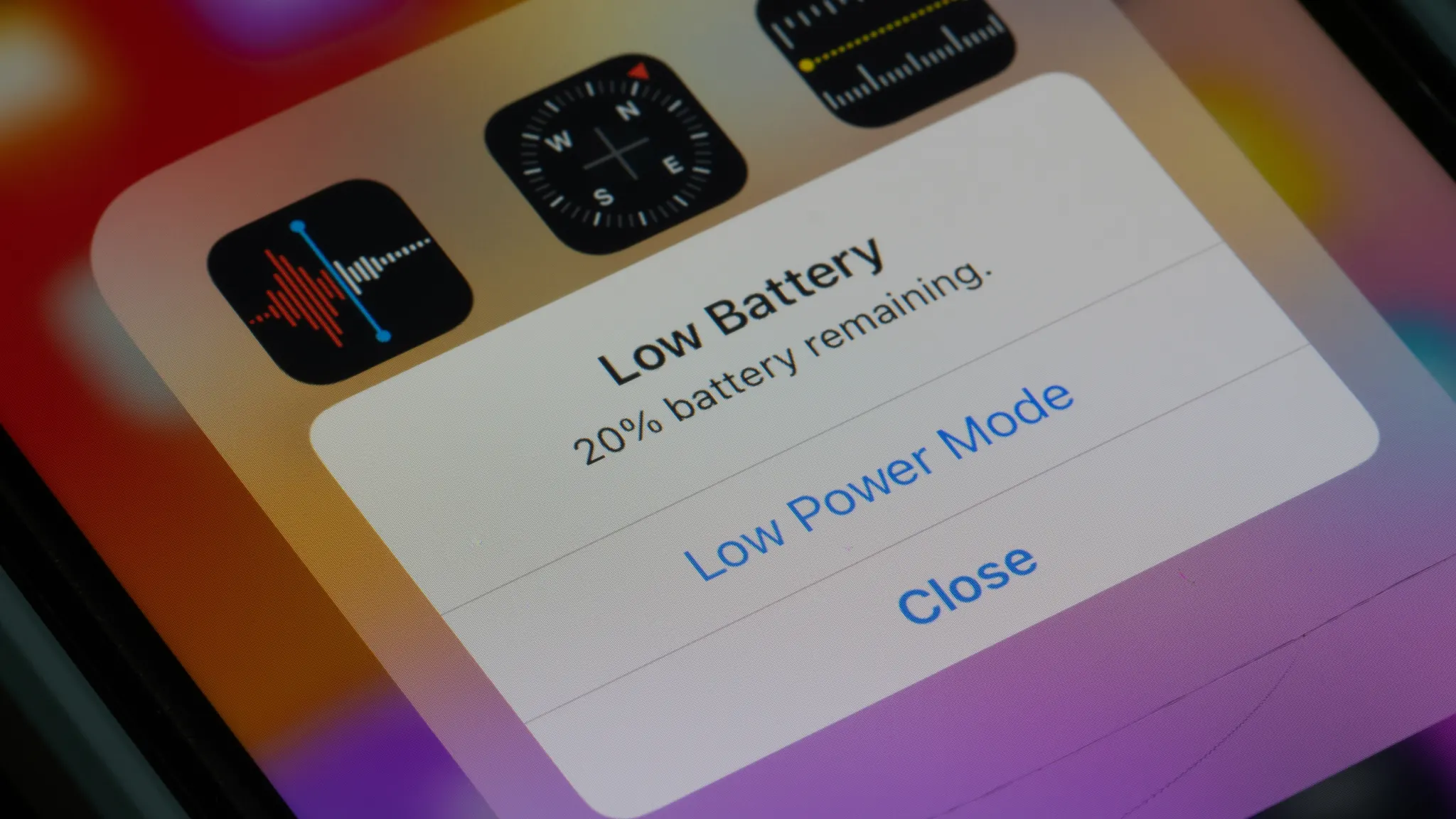 iPhone low battery warning, illustrating how to fix battery drain issues after iOS 26 update