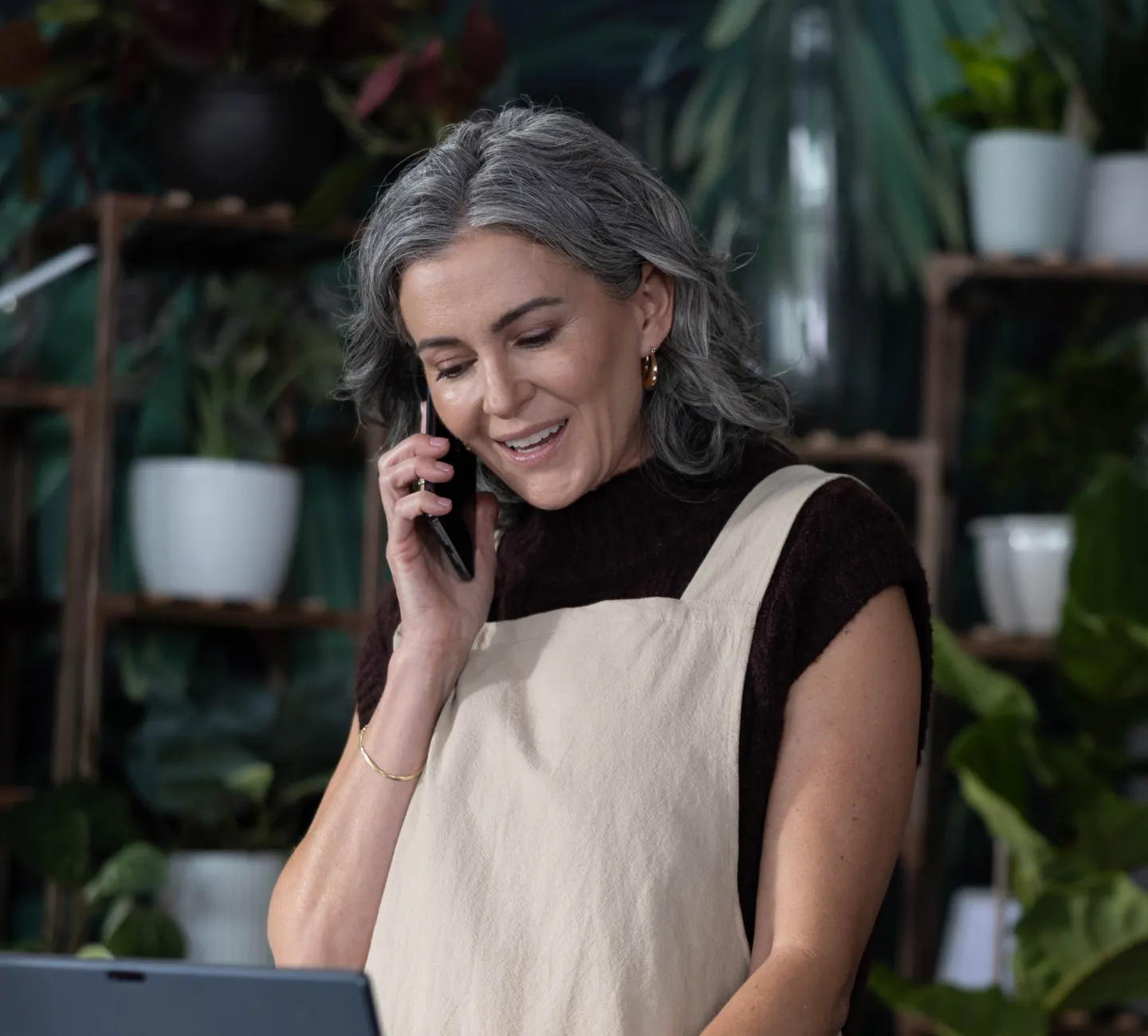 Woman using her cell phone in a store