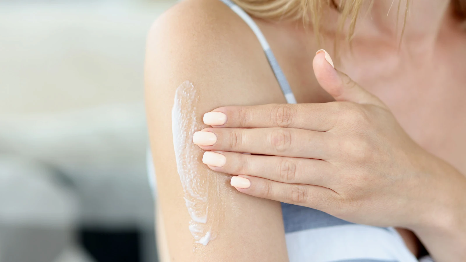 Applying cream on the arm