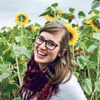 Portrait of Courtney in a field of sunflowers