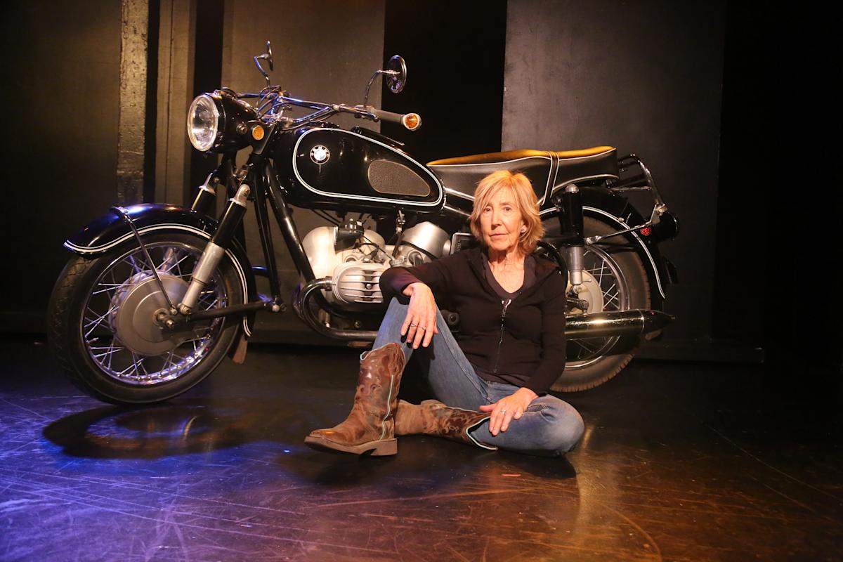 Actress posing with motorcycle