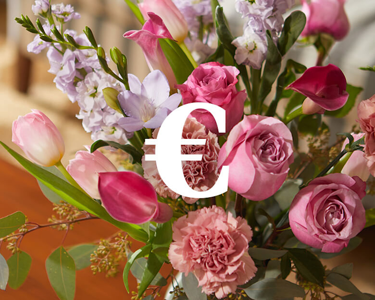 A close up of pink-toned stems, like roses, carnations and calla lilies. A pound sign appears in front of them.