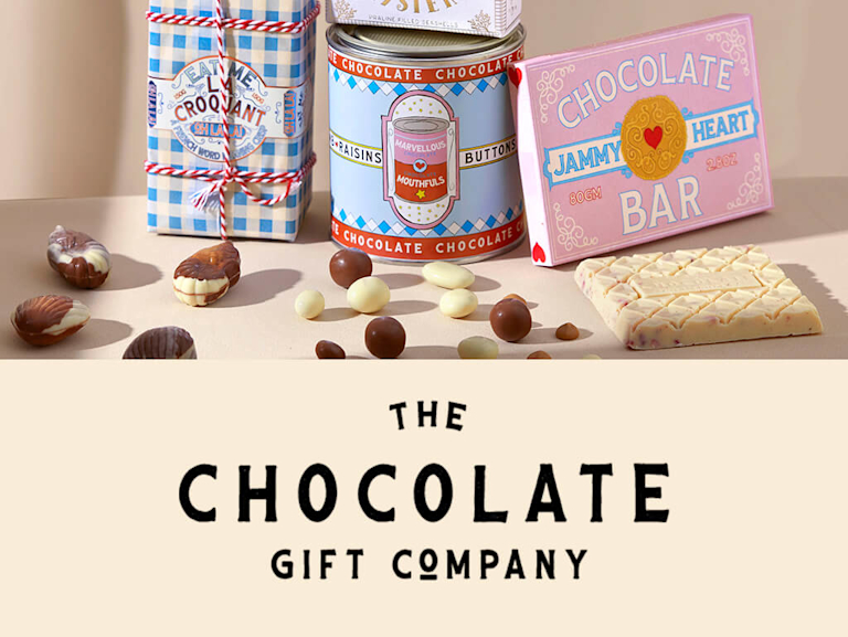 A selection of chocolate gifts in whimsical, pastel-coloured packaging next to The Chocolate Gift Company's logo.