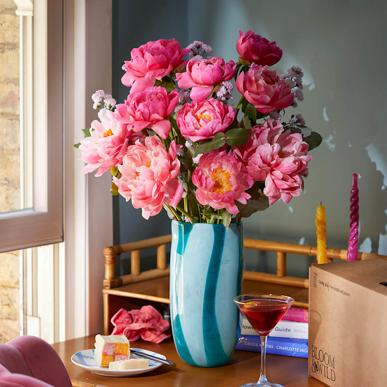 pink peony bouquet in blue vase