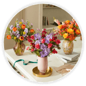 Three spring bouquets in vases on a table