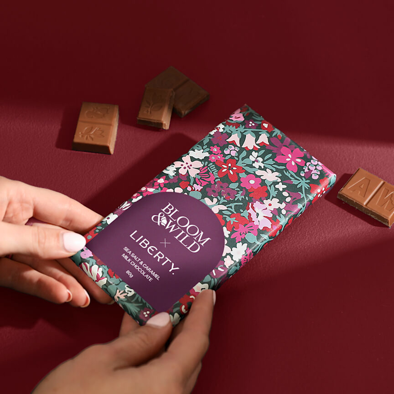 A sea salt and caramel chocolate bar, wrapped in a Liberty print.