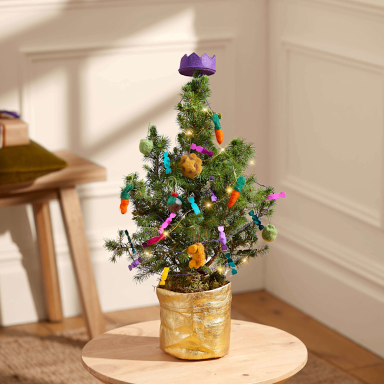 A miniature Christmas tree, decorated with roast dinner items (like minced pies, turkey, and a Brussels sprout).