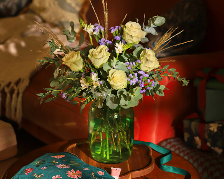 A Bloom & Wild bouquet on a coffee table