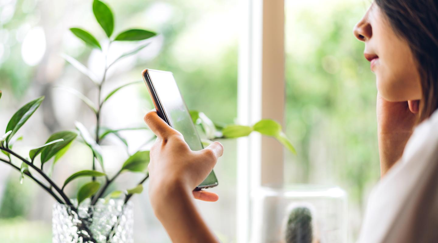 A person looking at their smartphone.