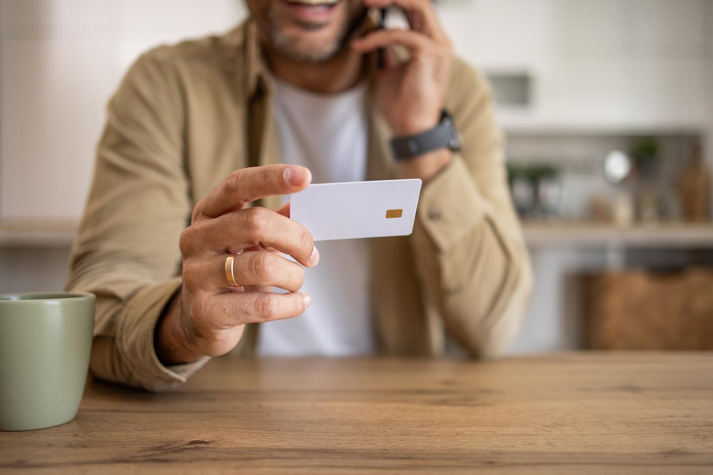 A person holding a SIM card.