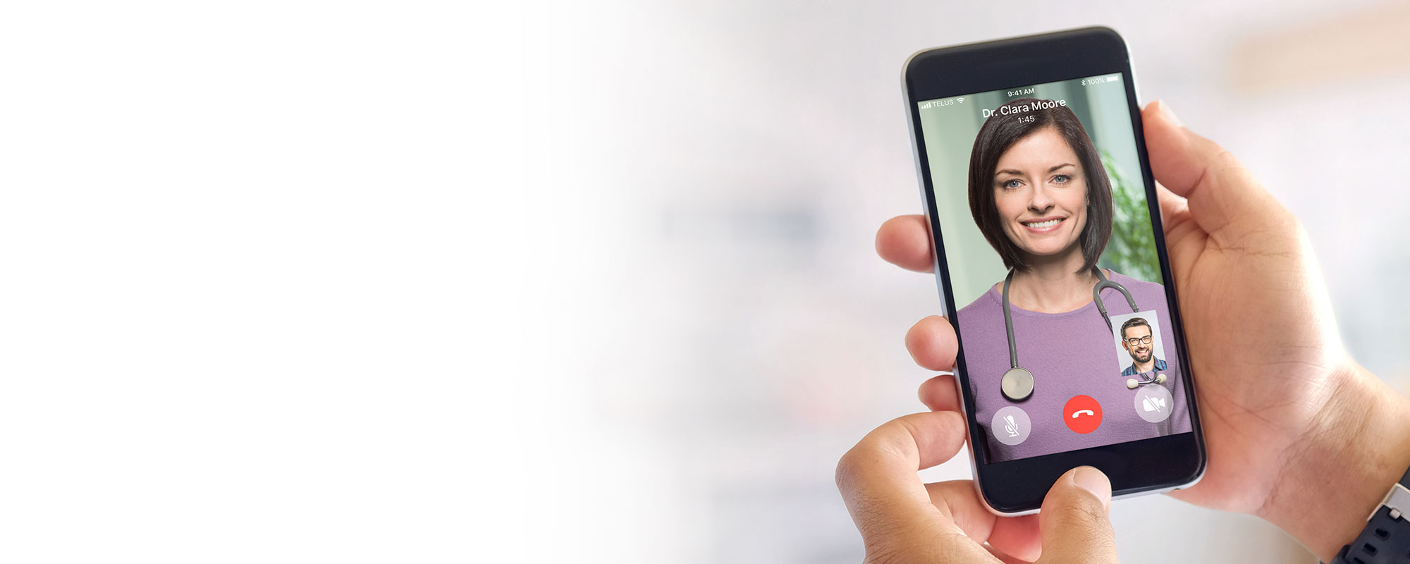An individual holding their mobile phone and video chatting with a Babylon doctor