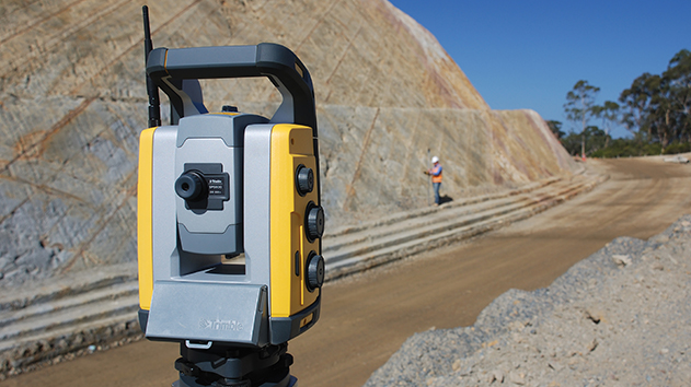 Trimble SPS930 universal total station gathering survey data on a roading project