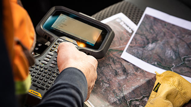 The Trimble TSC510 controller using field-to-office connectivity for reporting in a vehicle cab