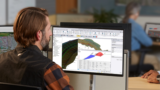 Trimble Business Center software on a desktop computer in the office displaying a model in the field