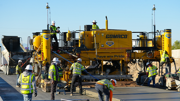 Construction crew and paver using Trimble Paving Control on a concrete roading project