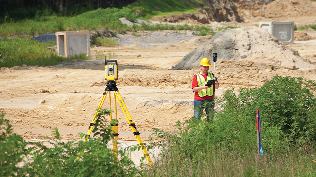 Surveyor on a construction site using the Trimble SPS720 Total Station