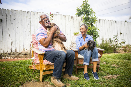 older could sitting with dogs