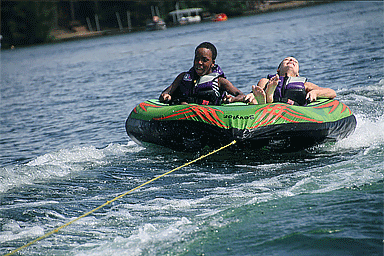 Children riding inside an inner tube during AAD's Camp Discovery