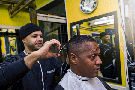 African American man getting a hair cut