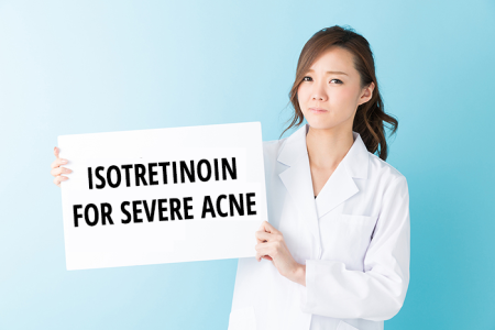 Doctor showing sign with Isotretinoin severe acne