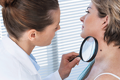 Dermatologist performing a skin exam