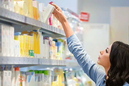 Woman shopping for skin care products in department store