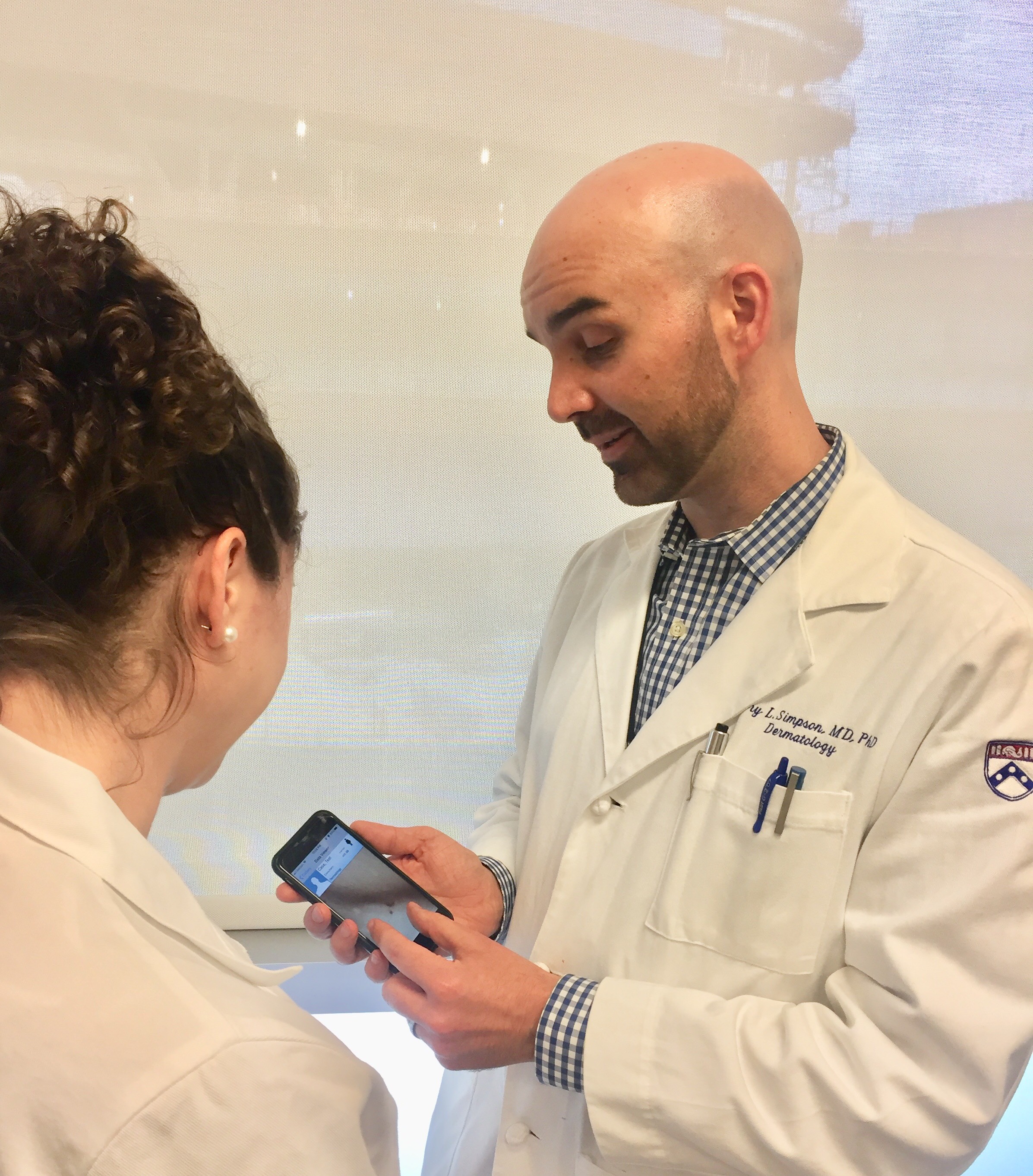 Image of Simpson with patient for VMX News