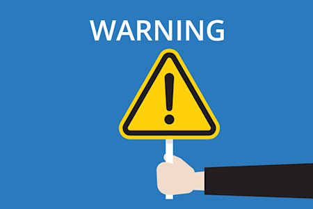 Illustration of a hand holding an exclamation warning sign