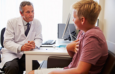 physician speaking to teen