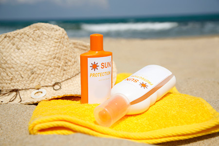 Sunscreen bottles and a hat