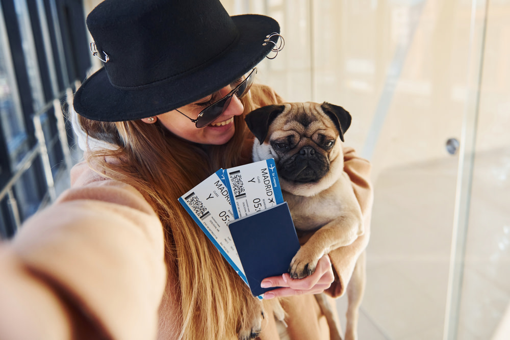woman traveling with dog
