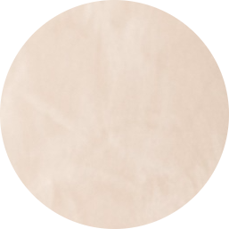 Un cercle beige clair uni avec un motif texturé subtil sur un fond transparent.