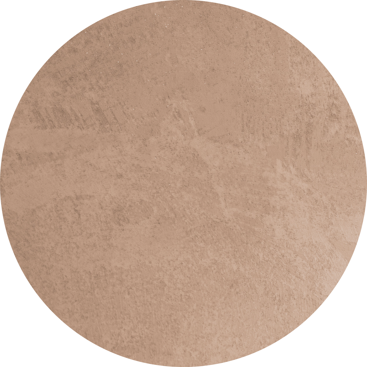 Une surface plate et circulaire avec une texture brun clair ressemblant à un gros plan de poudre ou de sable.