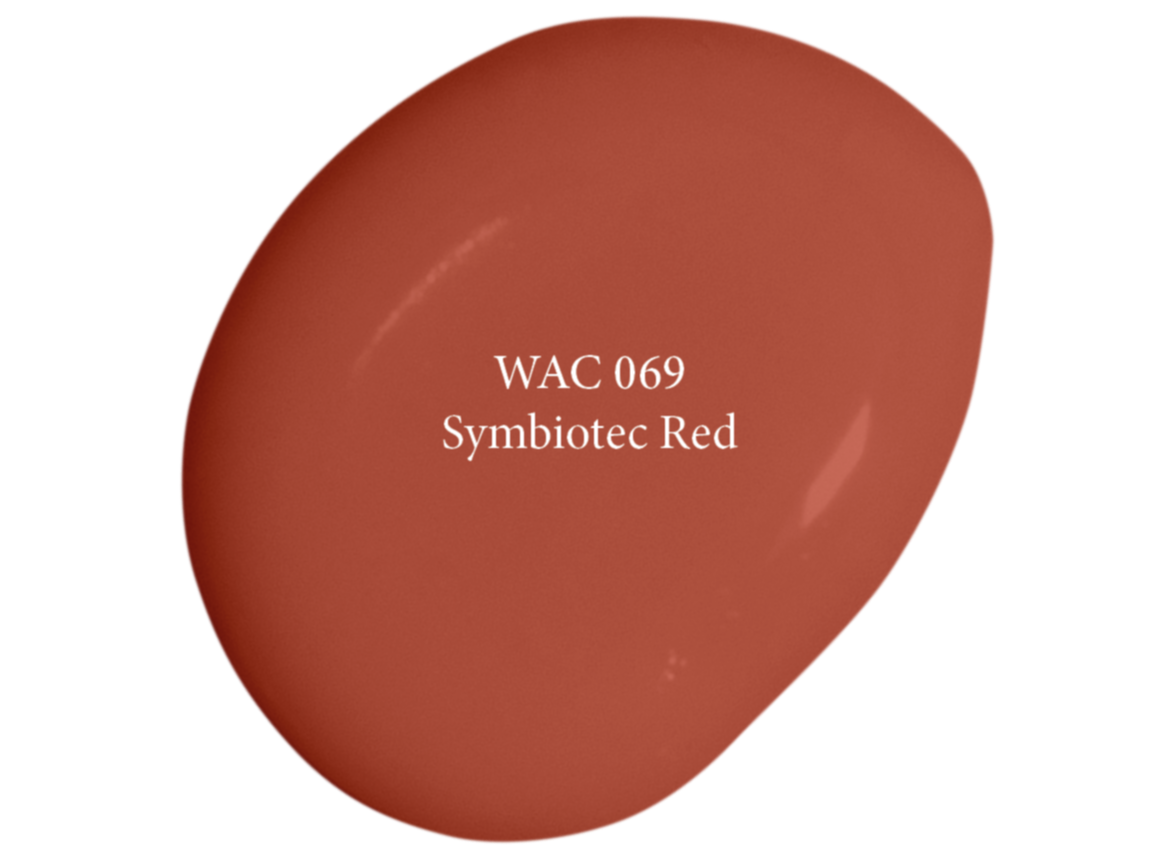 Une goutte de peinture rouge portant la mention « WAC 069 Symbiotec Red » et la légende « TRENDSPECIAL 2027 » en lettres blanches sur un fond uni.